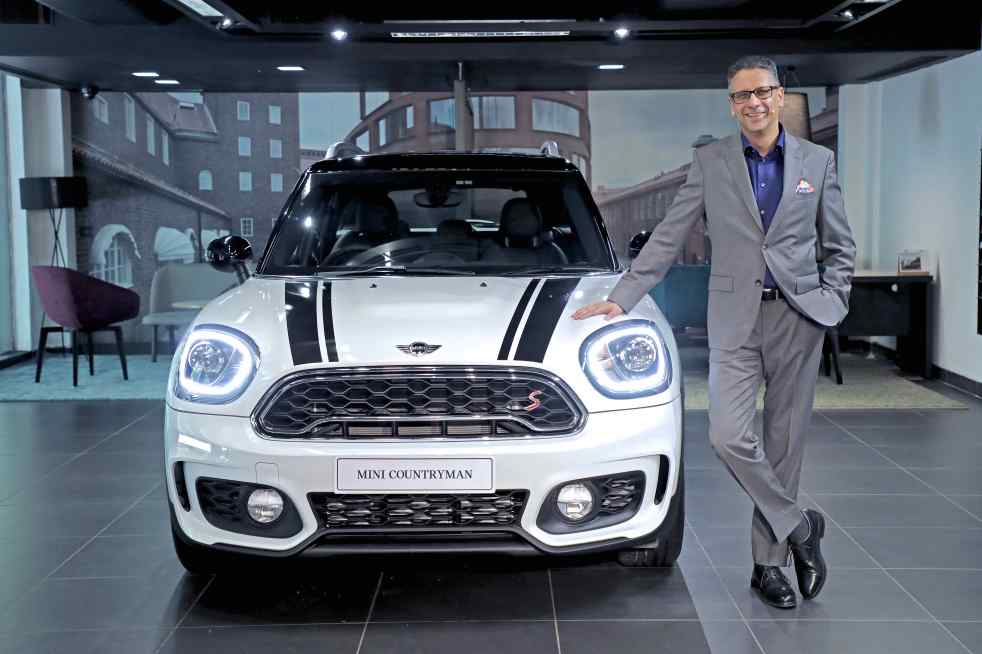 01 Mr. Vikram Pawah, President, BMW Group India with the all-new MINI Co...