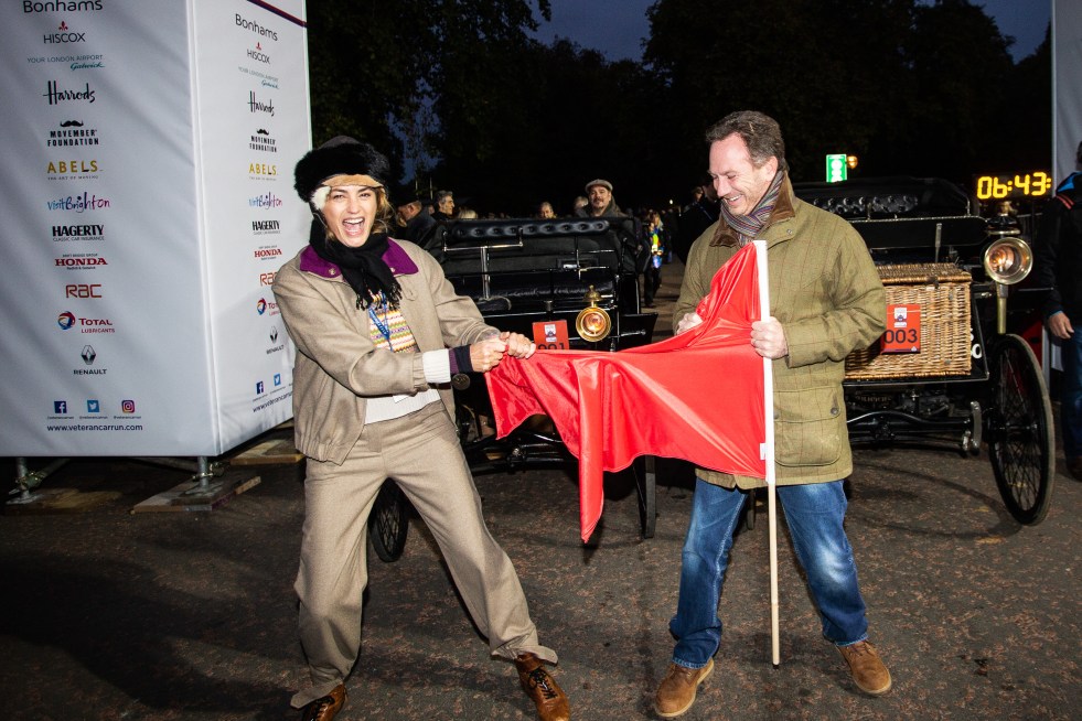 Yasmin Le Bon and Christian Horner ripping the cerimonial Red Flag before the start of the 2018 Bonhams London to Brighton Veteran Car Run