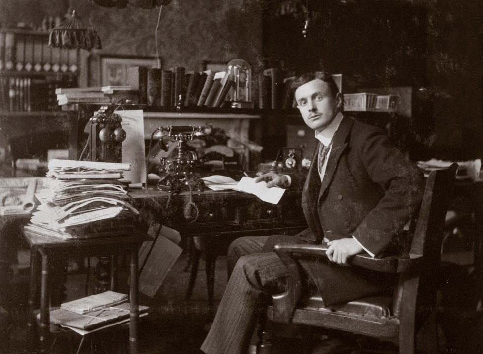 C S Rolls sitting at his desk, c 1902.